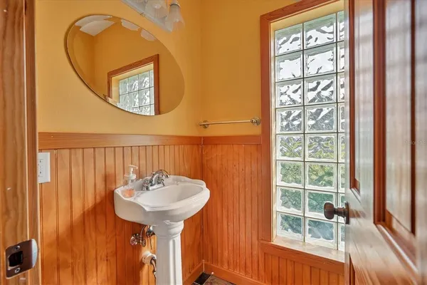 a bathroom with a sink and a mirror