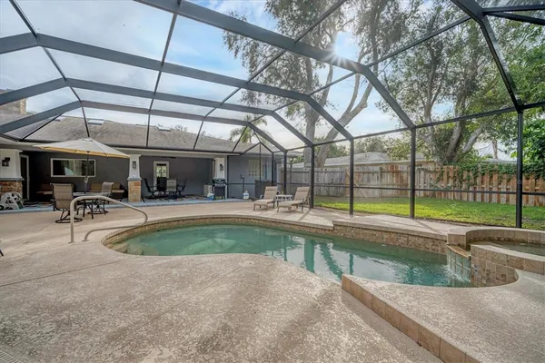 a view of a swimming pool with a patio