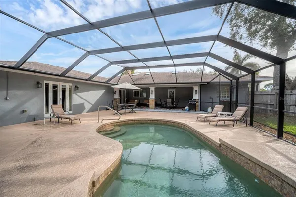a view of a swimming pool with a patio