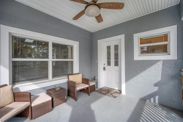 a living room with furniture and a window
