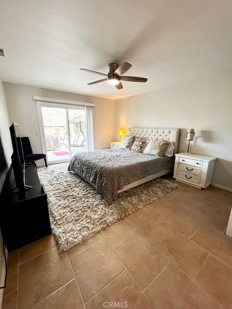 803 Caminito Azul Carlsbad, CA 92011 - Photo 13 of 44 a bedroom with a bed and window