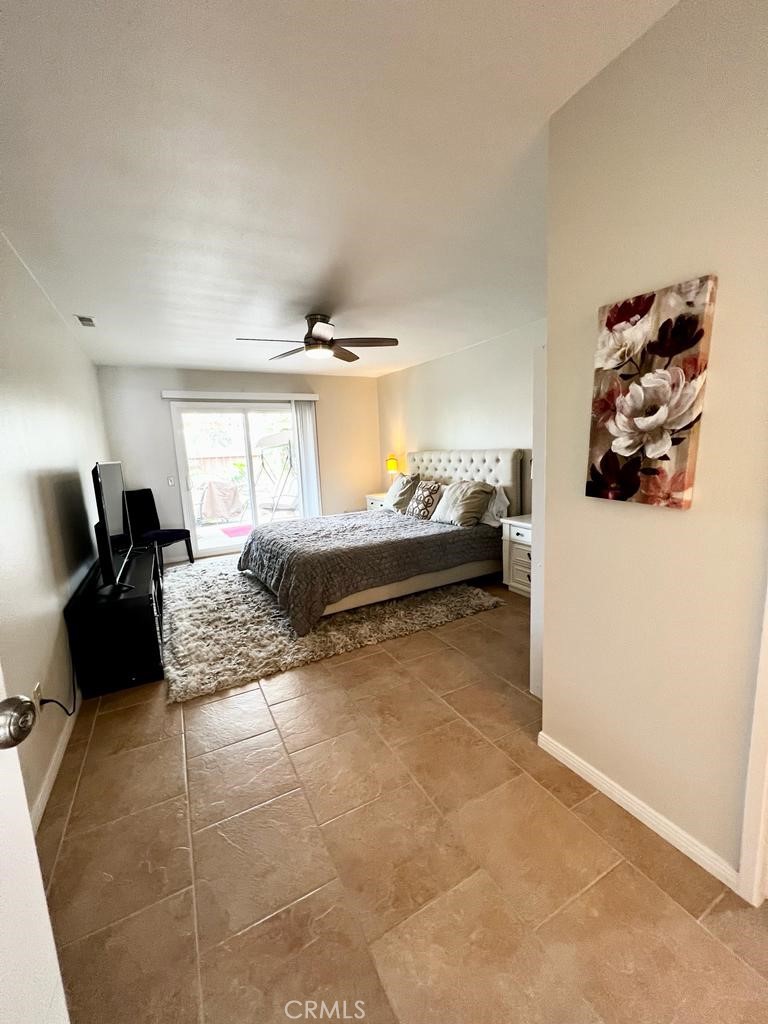 803 Caminito Azul Carlsbad, CA 92011 - Photo 18 of 44 a bedroom with a bed and a couch