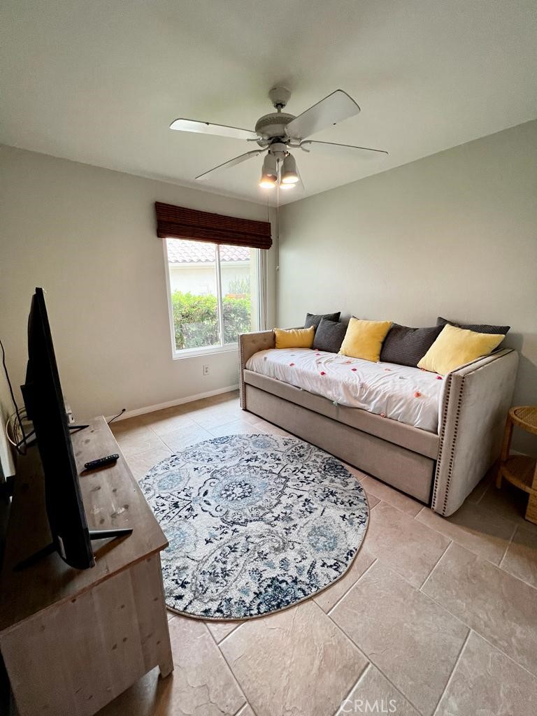 803 Caminito Azul Carlsbad, CA 92011 - Photo 22 of 44 a living room with a bed furniture and a window