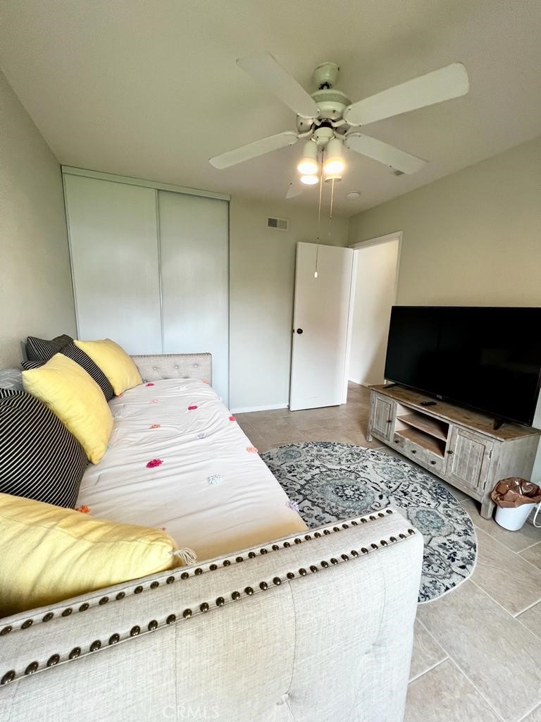 803 Caminito Azul Carlsbad, CA 92011 - Photo 23 of 44 a bedroom with a bed and a flat screen tv