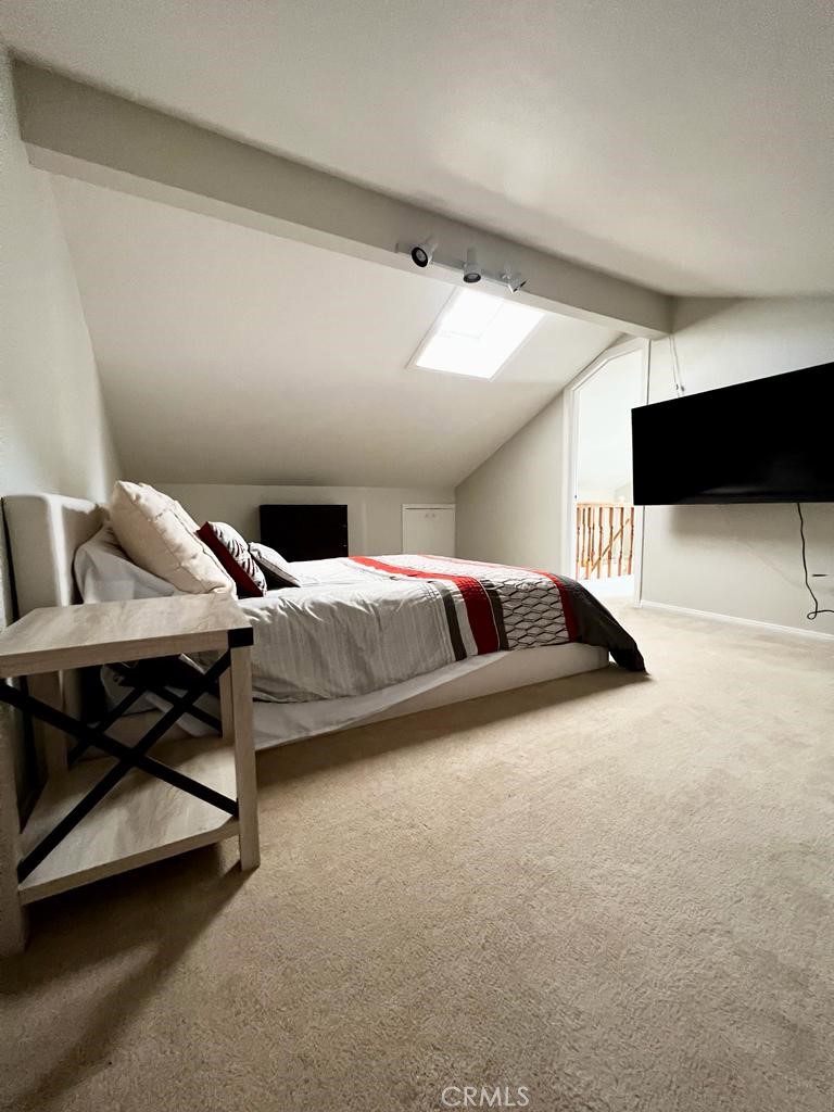 803 Caminito Azul Carlsbad, CA 92011 - Photo 28 of 44 a bedroom with furniture and a lamp