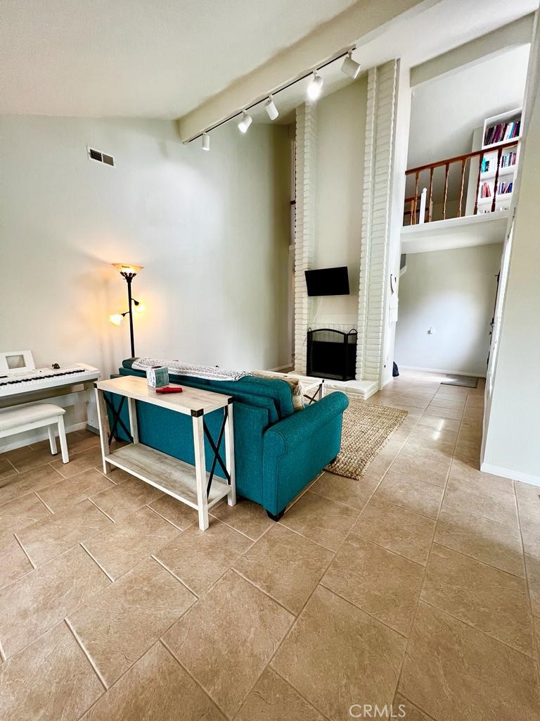 803 Caminito Azul Carlsbad, CA 92011 - Photo 4 of 44 a living room with furniture and a fireplace