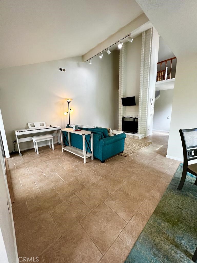 803 Caminito Azul Carlsbad, CA 92011 - Photo 5 of 44 a view of a livingroom with furniture and a kitchen