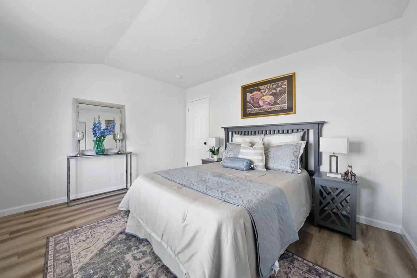 1693 Greentree Drive Concord, CA 94521 - Photo 21 of 40 a bedroom with a bed and a painting on the wall