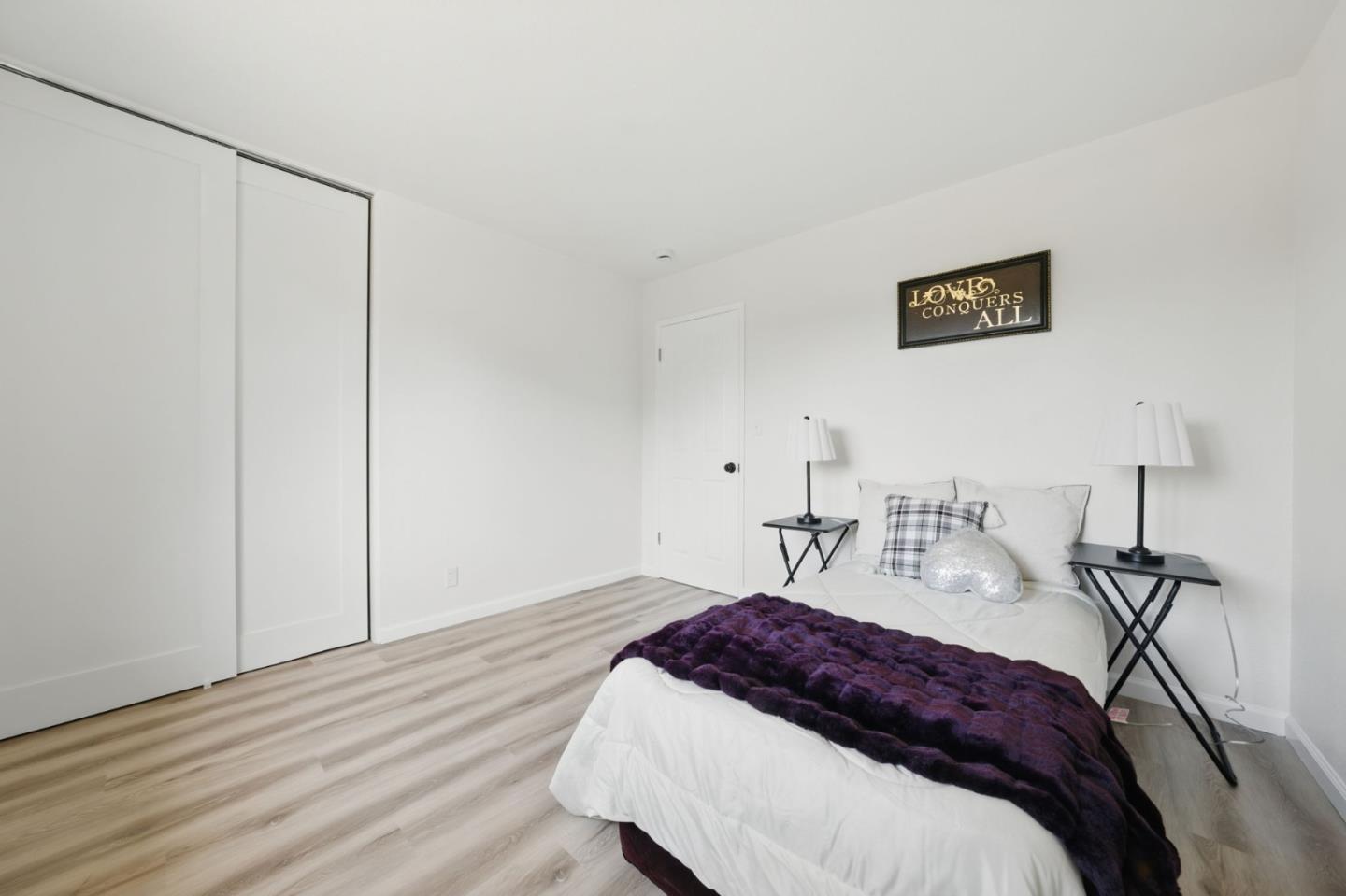 1693 Greentree Drive Concord, CA 94521 - Photo 23 of 40 a bedroom with a bed and a night stand