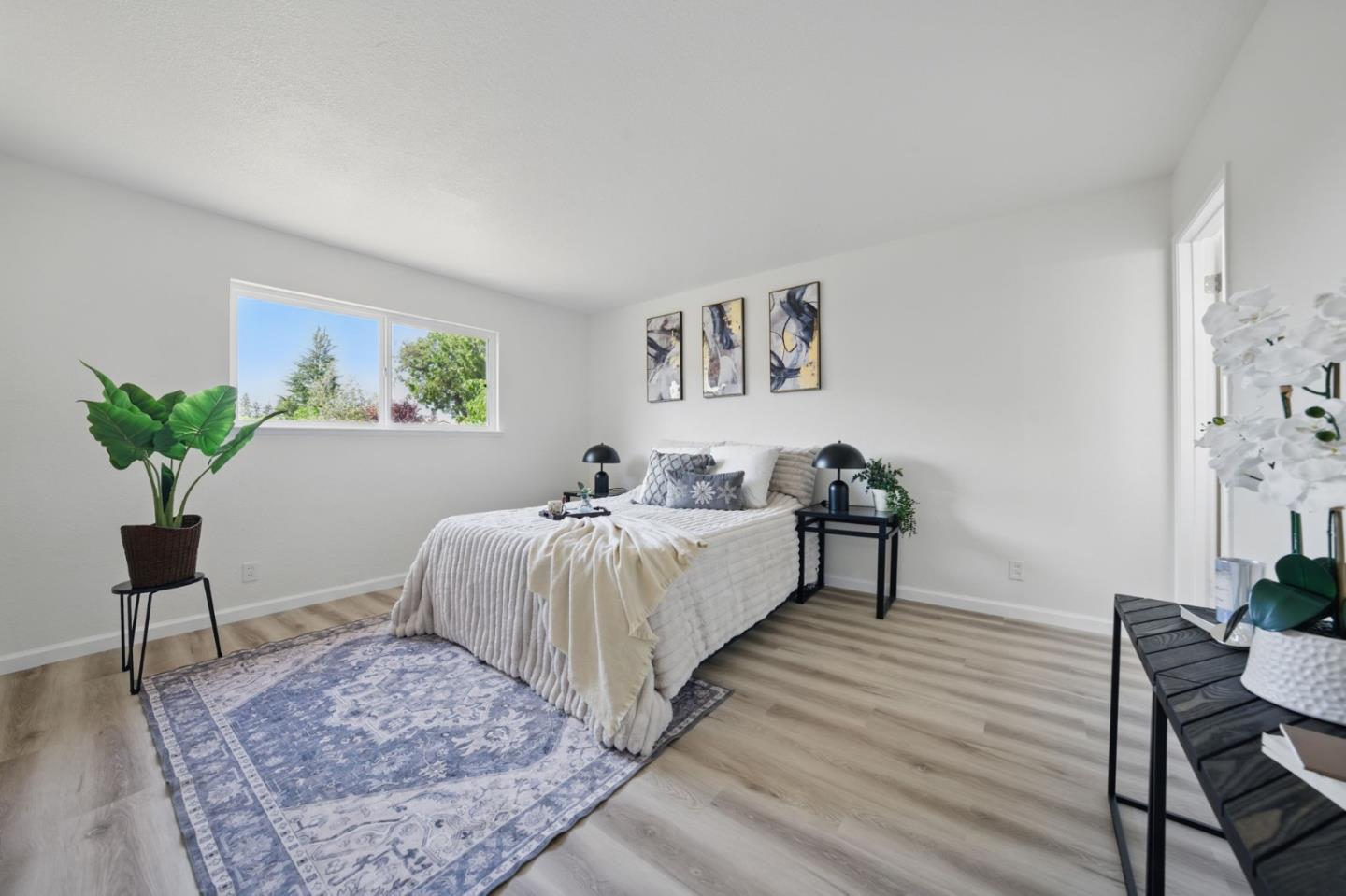 1693 Greentree Drive Concord, CA 94521 - Photo 24 of 40 a spacious bedroom with a bed and a table