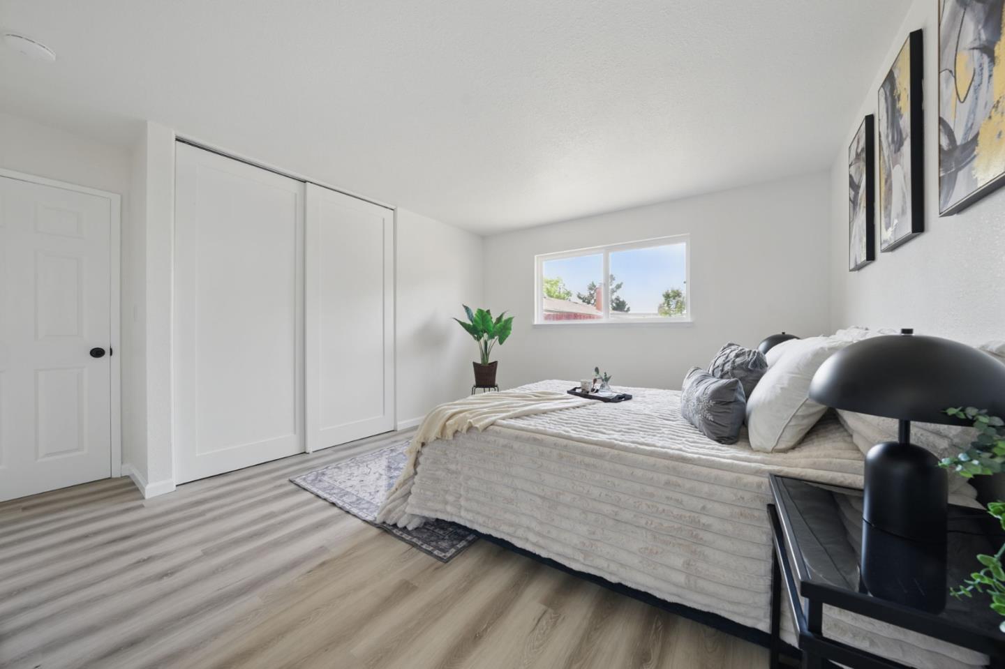 1693 Greentree Drive Concord, CA 94521 - Photo 25 of 40 a bedroom with a bed and wooden floor