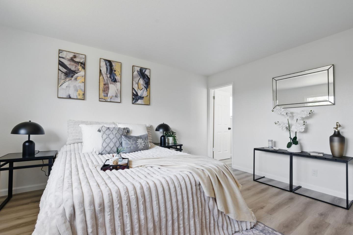 1693 Greentree Drive Concord, CA 94521 - Photo 26 of 40 a bedroom with a bed and a lamp on dresser