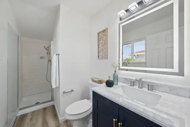 a bathroom with a glass shower door