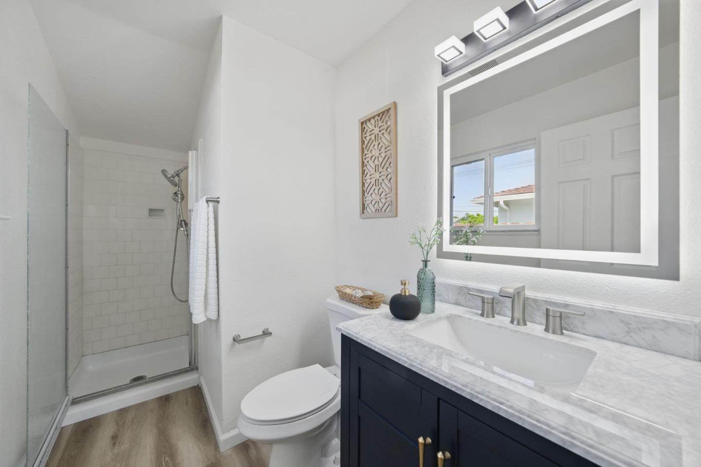 1693 Greentree Drive Concord, CA 94521 - Photo 27 of 40 a bathroom with a granite countertop toilet sink and mirror