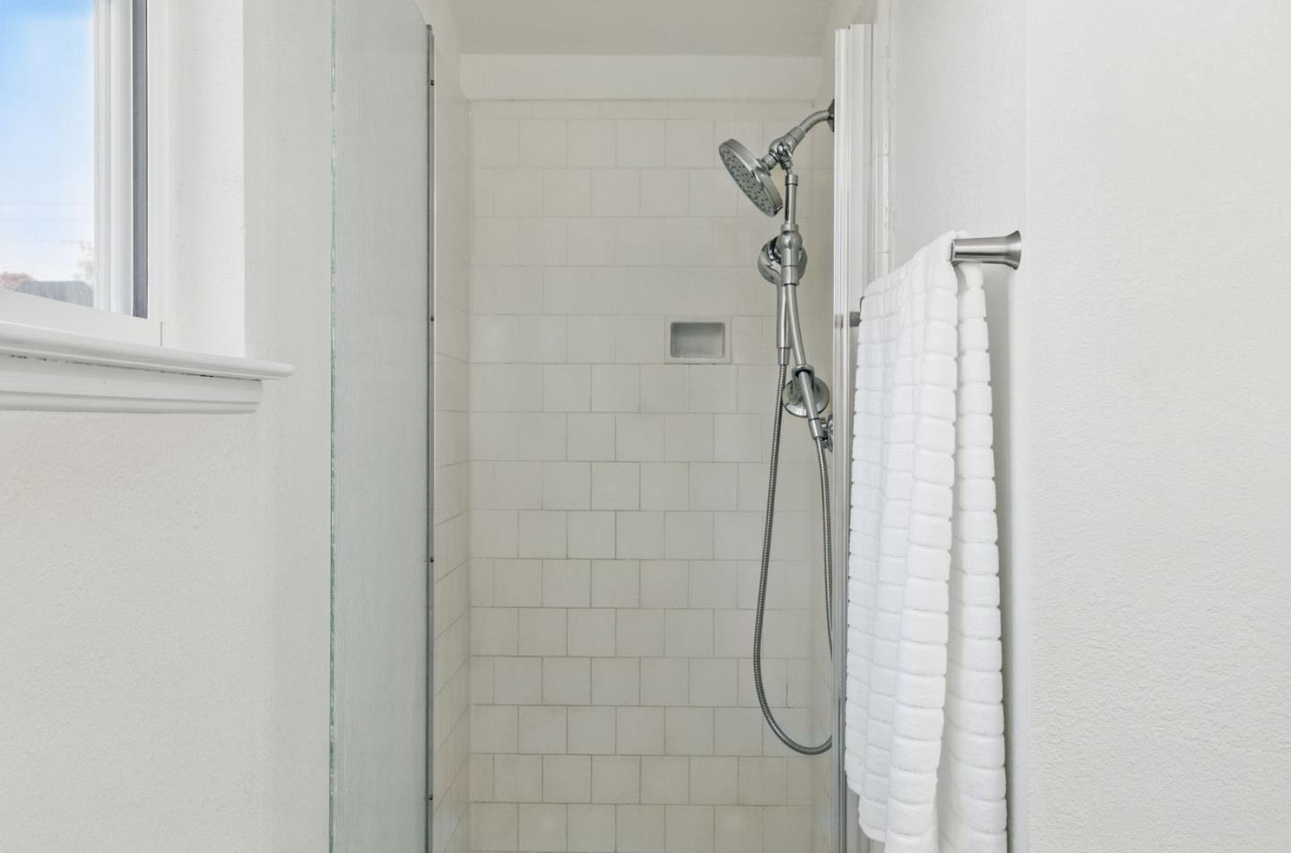 1693 Greentree Drive Concord, CA 94521 - Photo 28 of 40 a bathroom with a glass shower door