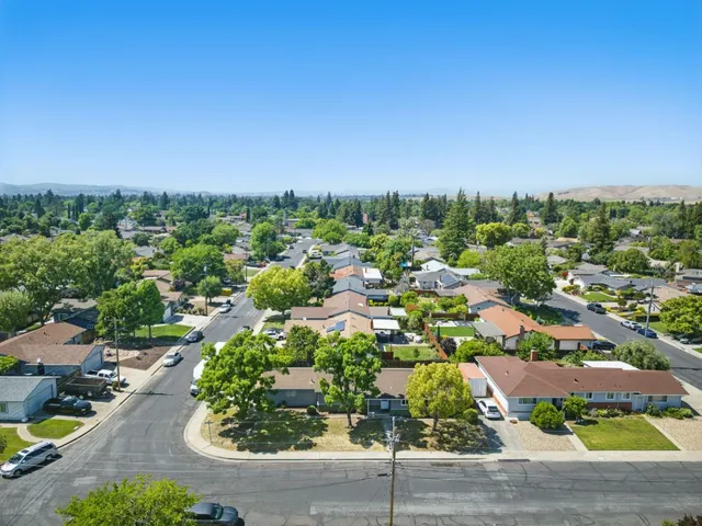 a view of swimming pool with outdoor seating and yard in back
