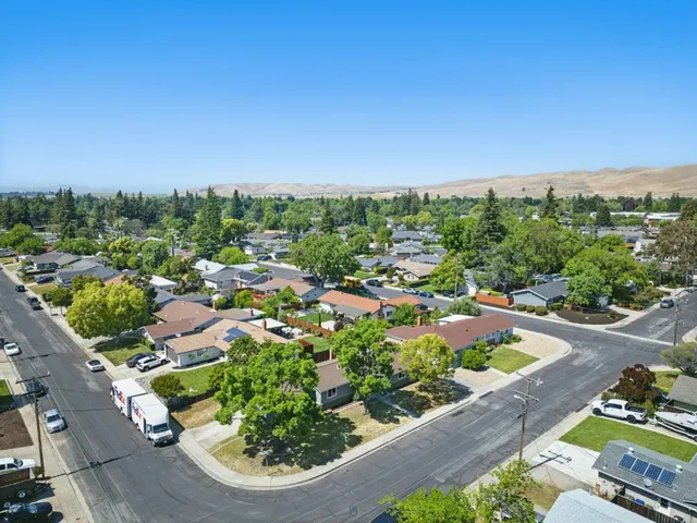 an aerial view of a house with a garden