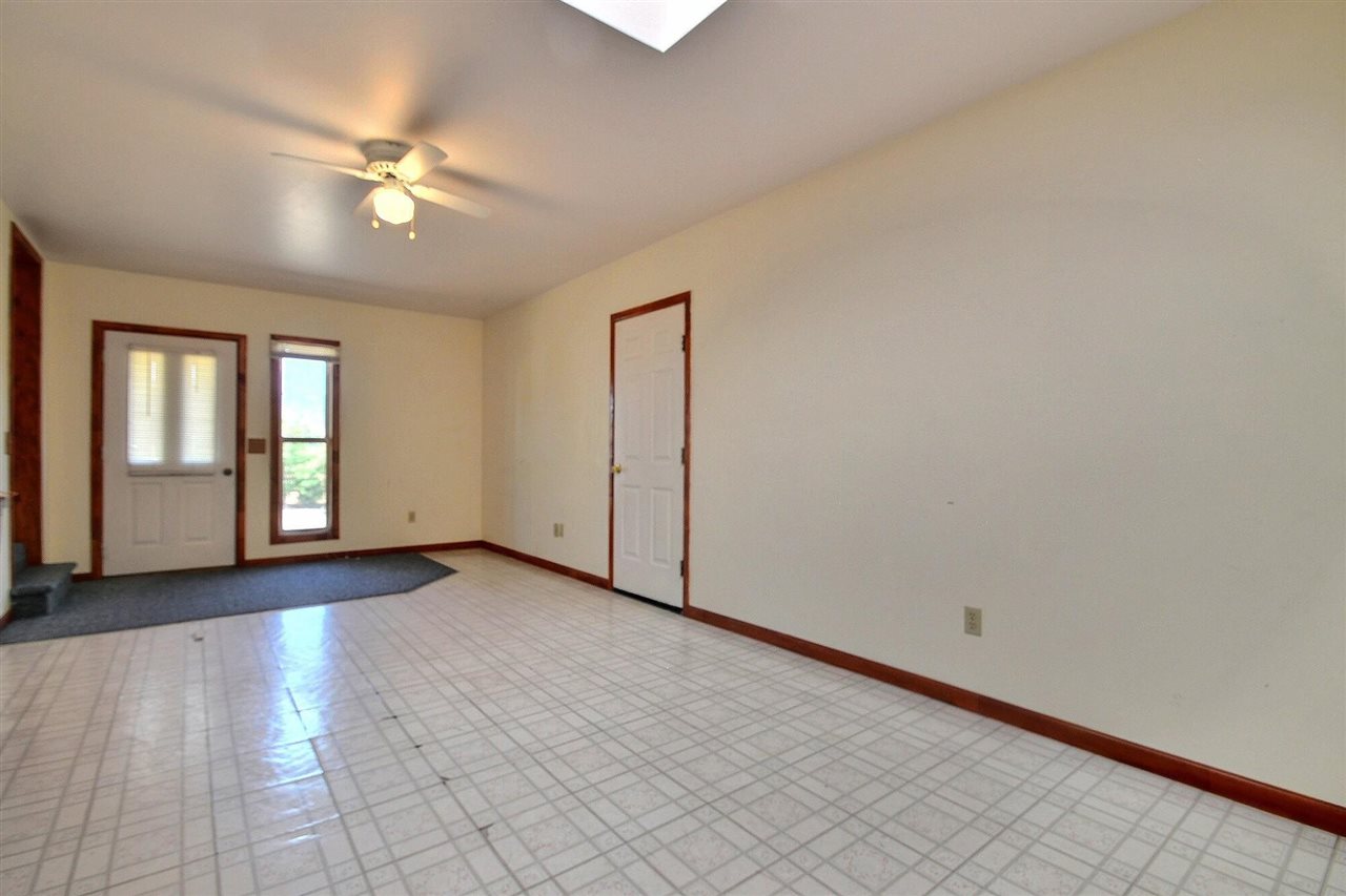 9198 1995th Road Austin, CO 81410 - Photo 6 of 15 a view of an empty room with glass door