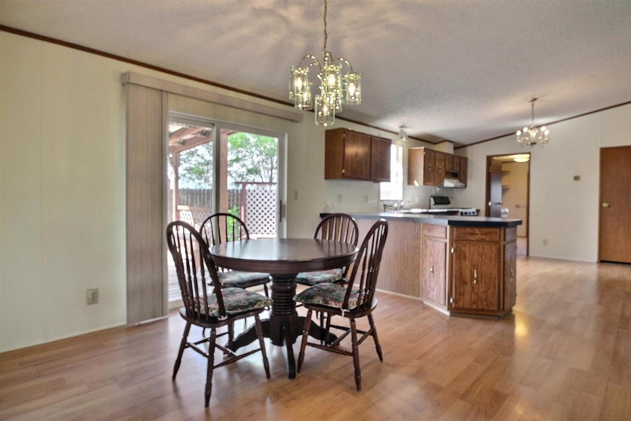 9198 1995th Road Austin, CO 81410 - Photo 9 of 15 a view of a dining room with furniture a chandelier and wooden floor