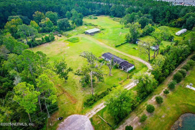 a view of a garden with a house