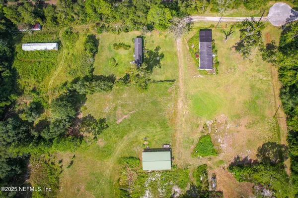 an aerial view of residential house with an outdoor space