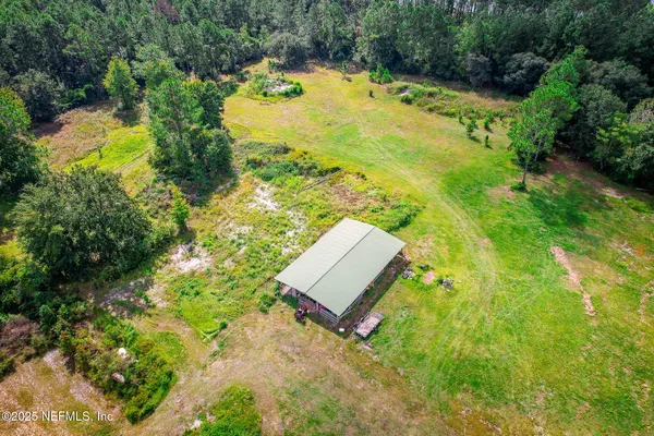 a bathroom with a small yard and covered with trees