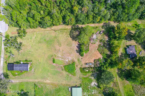 a view of a lake with a yard