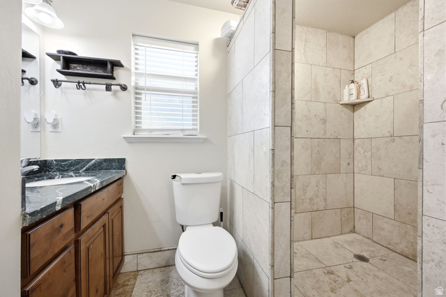 169 Taylor Road, Unit 101 Grantsville, UT 84029 - Photo 33 of 47 Walk-in shower with natural stone-look tiling and built-in shelf