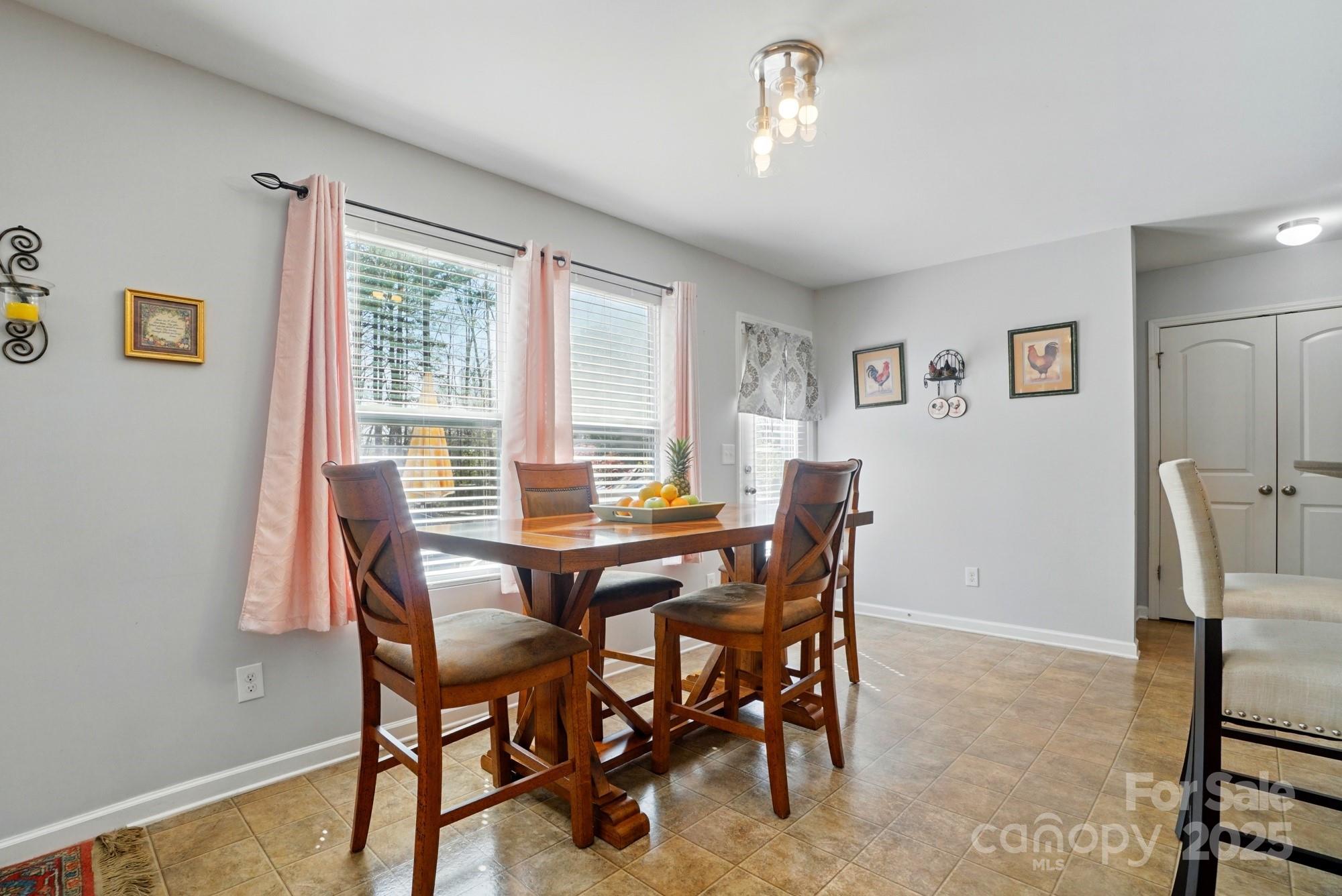 3272 Saddlebrook Drive Midland, NC 28107 - Photo 13 of 44 a view of a dining room with furniture