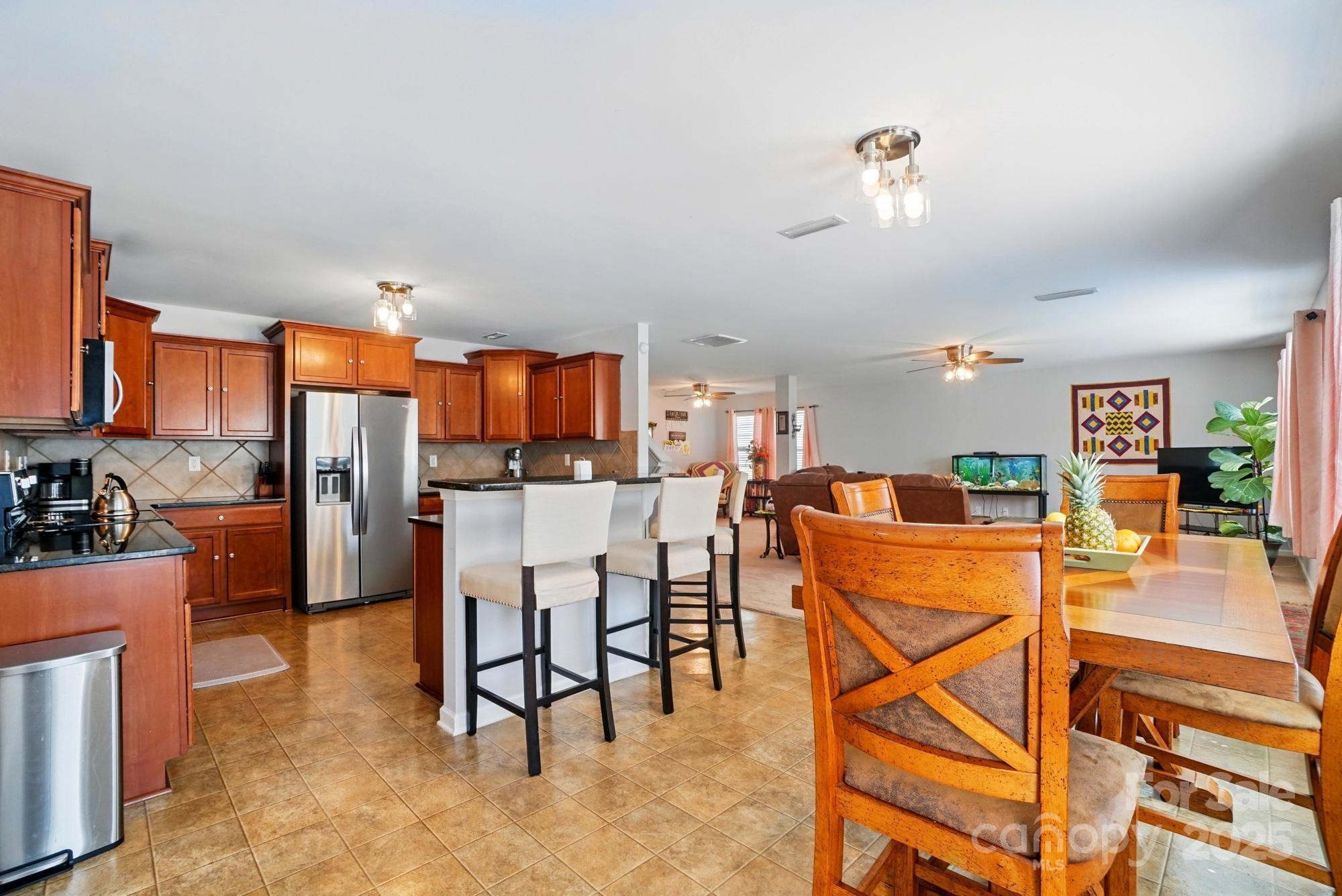 3272 Saddlebrook Drive Midland, NC 28107 - Photo 14 of 44 a view of a dining room kitchen and a livingroom