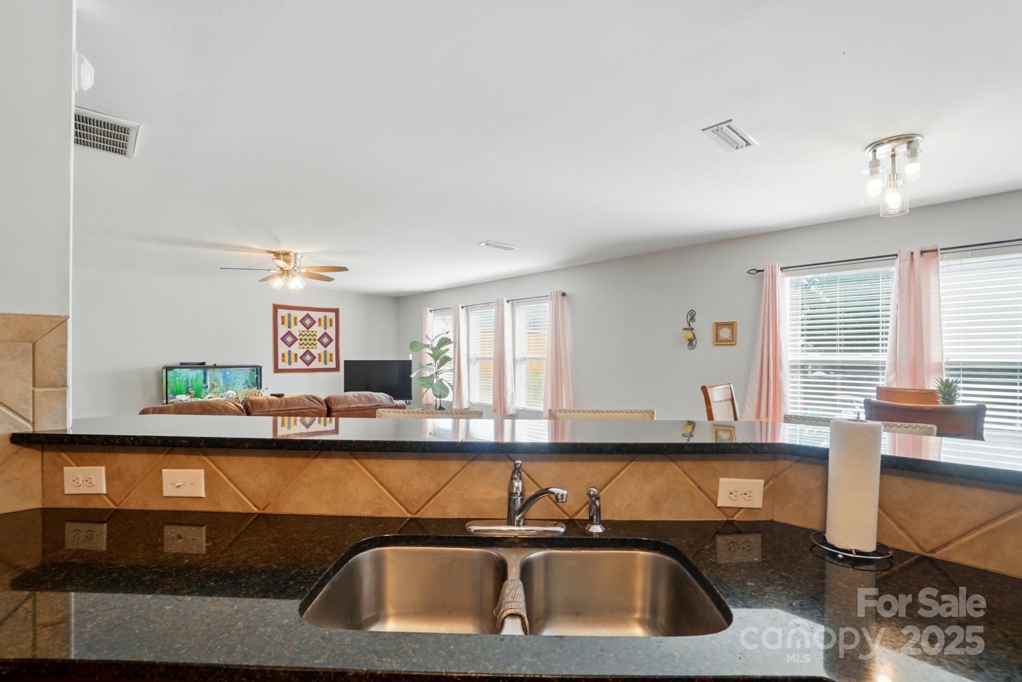 3272 Saddlebrook Drive Midland, NC 28107 - Photo 17 of 44 a kitchen with a sink and a cabinets