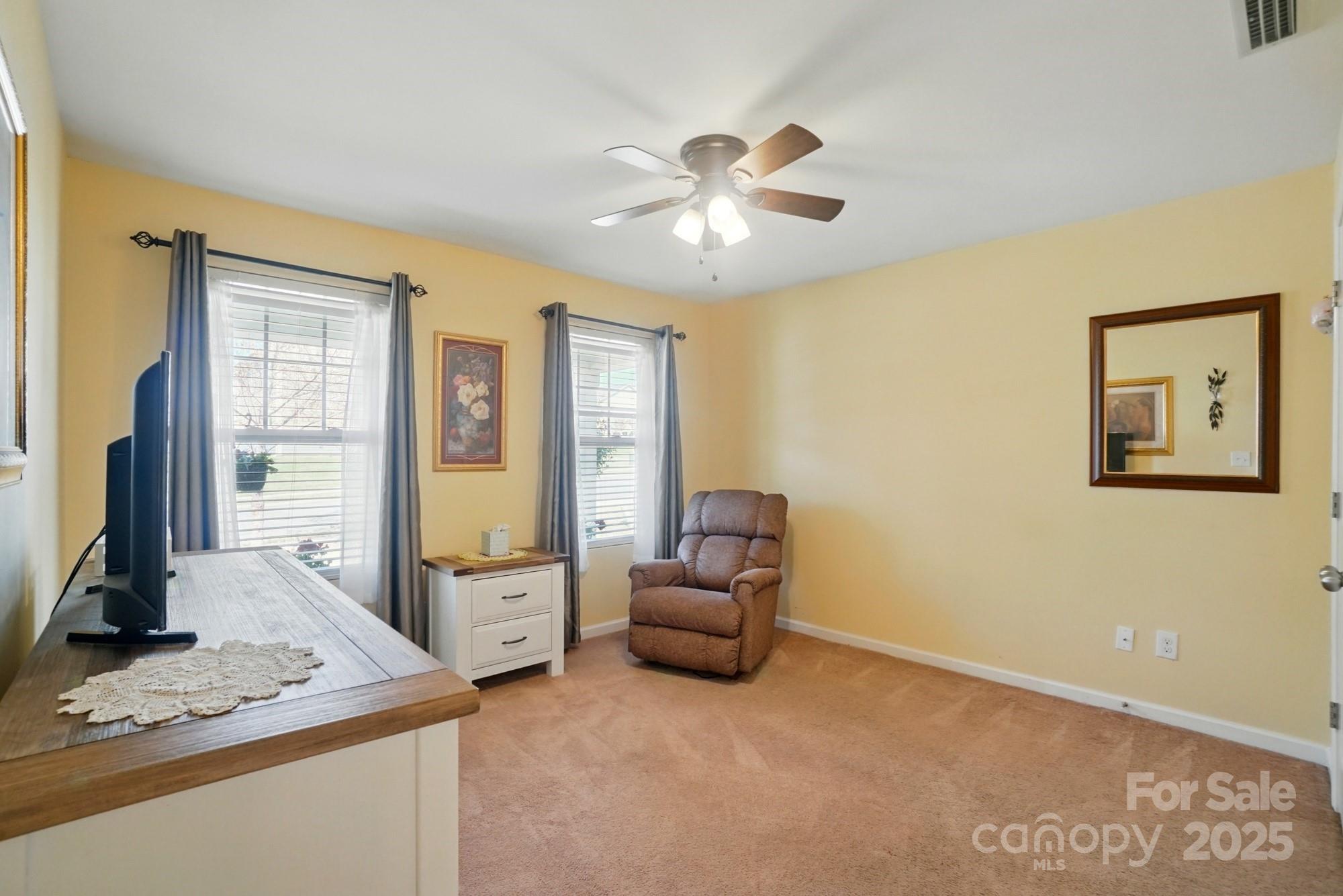 3272 Saddlebrook Drive Midland, NC 28107 - Photo 22 of 44 a living room with furniture and a flat screen tv