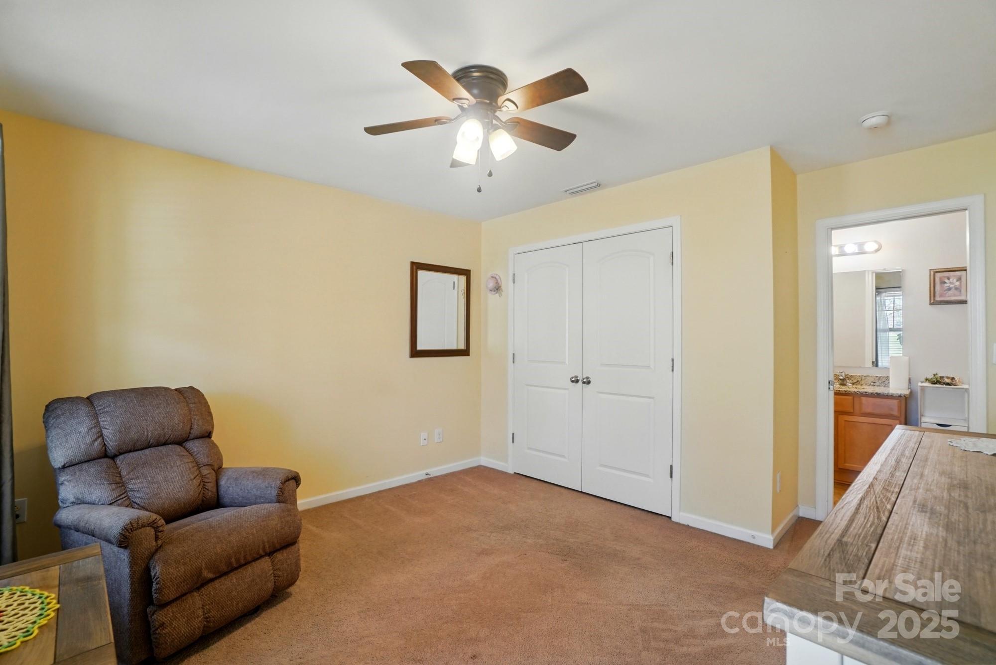3272 Saddlebrook Drive Midland, NC 28107 - Photo 23 of 44 a living room with furniture and ceiling fan