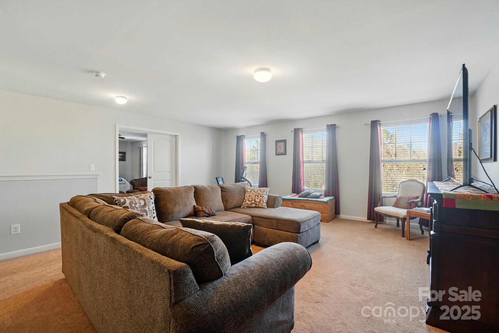 3272 Saddlebrook Drive Midland, NC 28107 - Photo 27 of 44 a living room with furniture and a large window