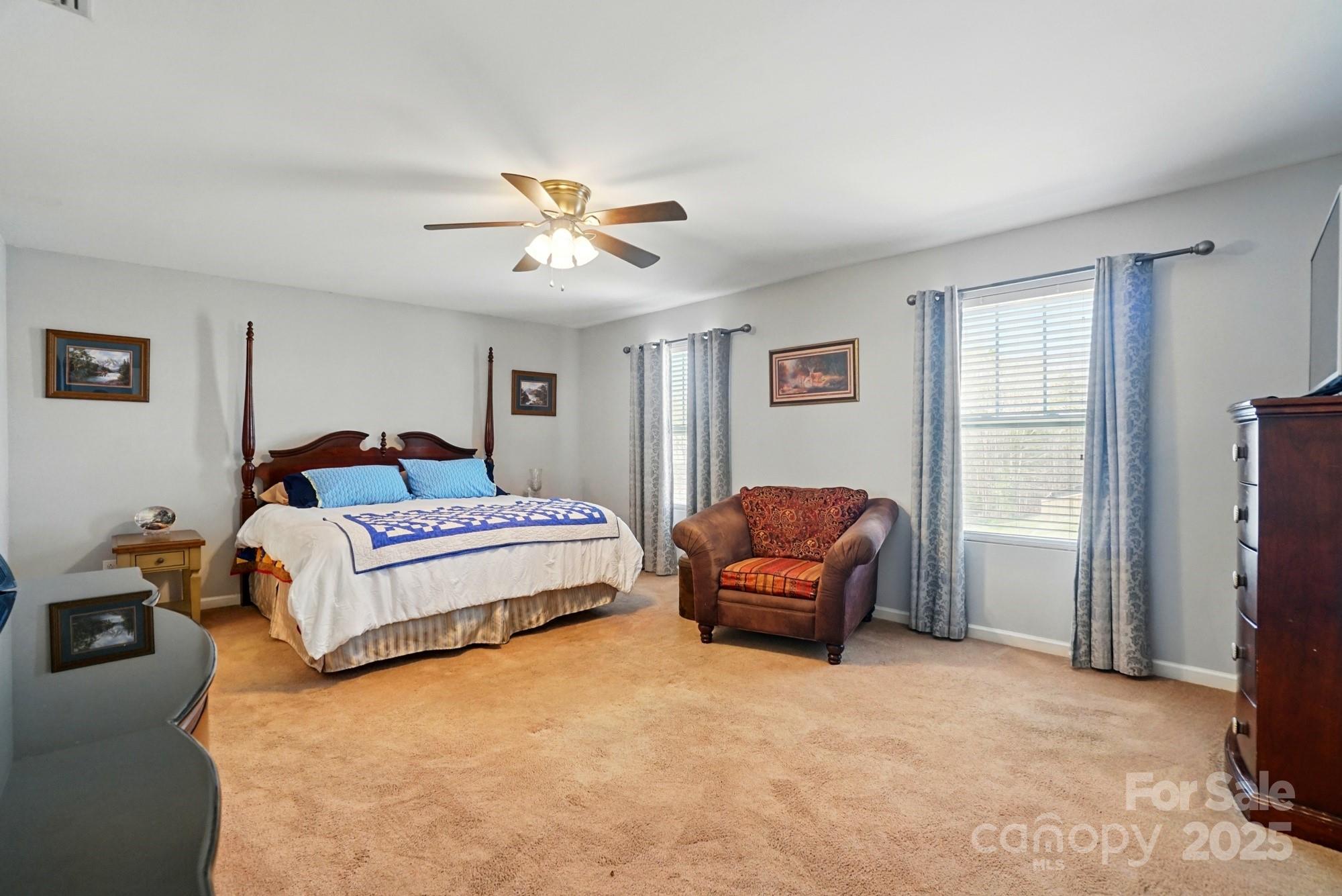 3272 Saddlebrook Drive Midland, NC 28107 - Photo 30 of 44 a bedroom with a bed couch and a window