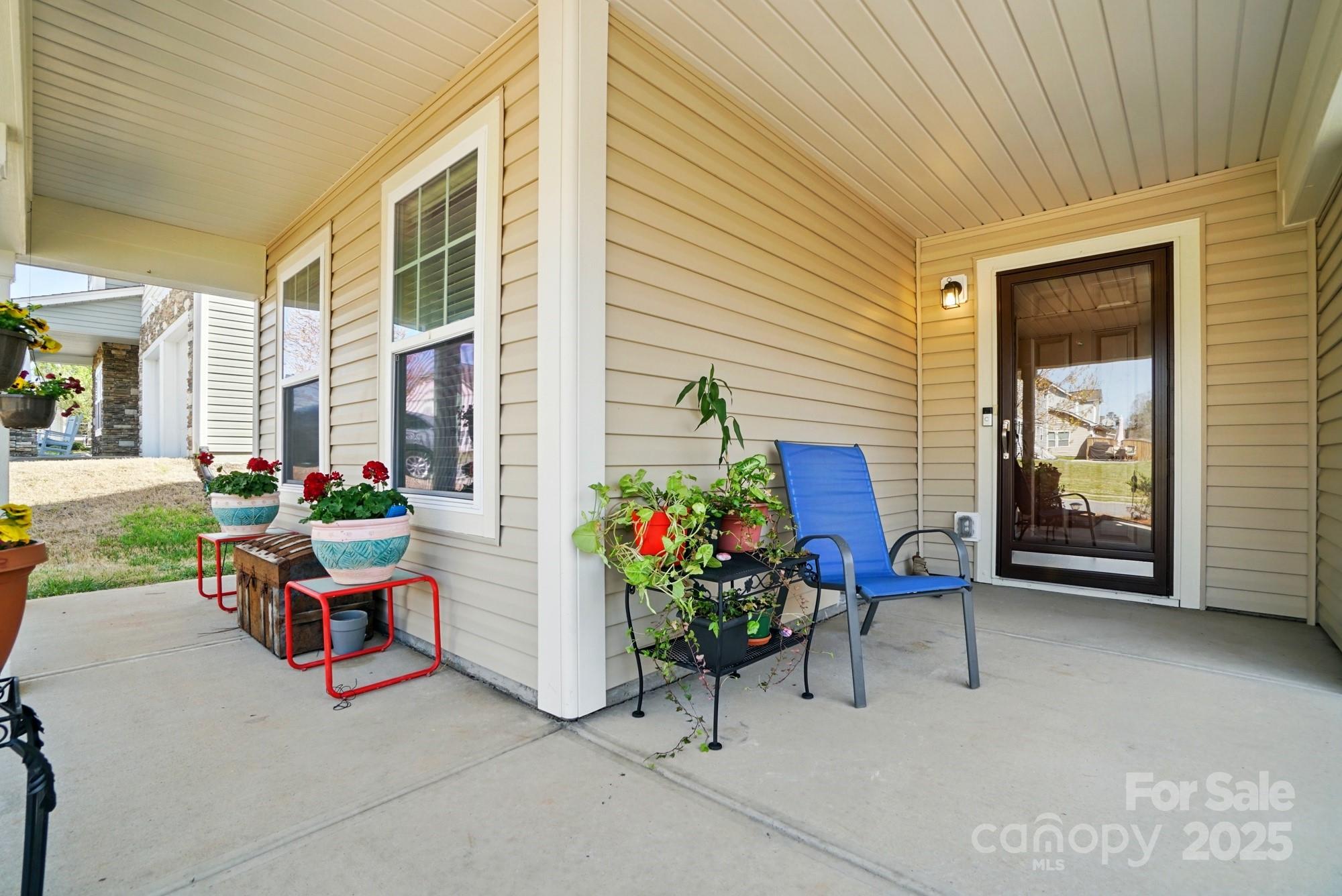 3272 Saddlebrook Drive Midland, NC 28107 - Photo 4 of 44 a backyard of a house with outdoor seating