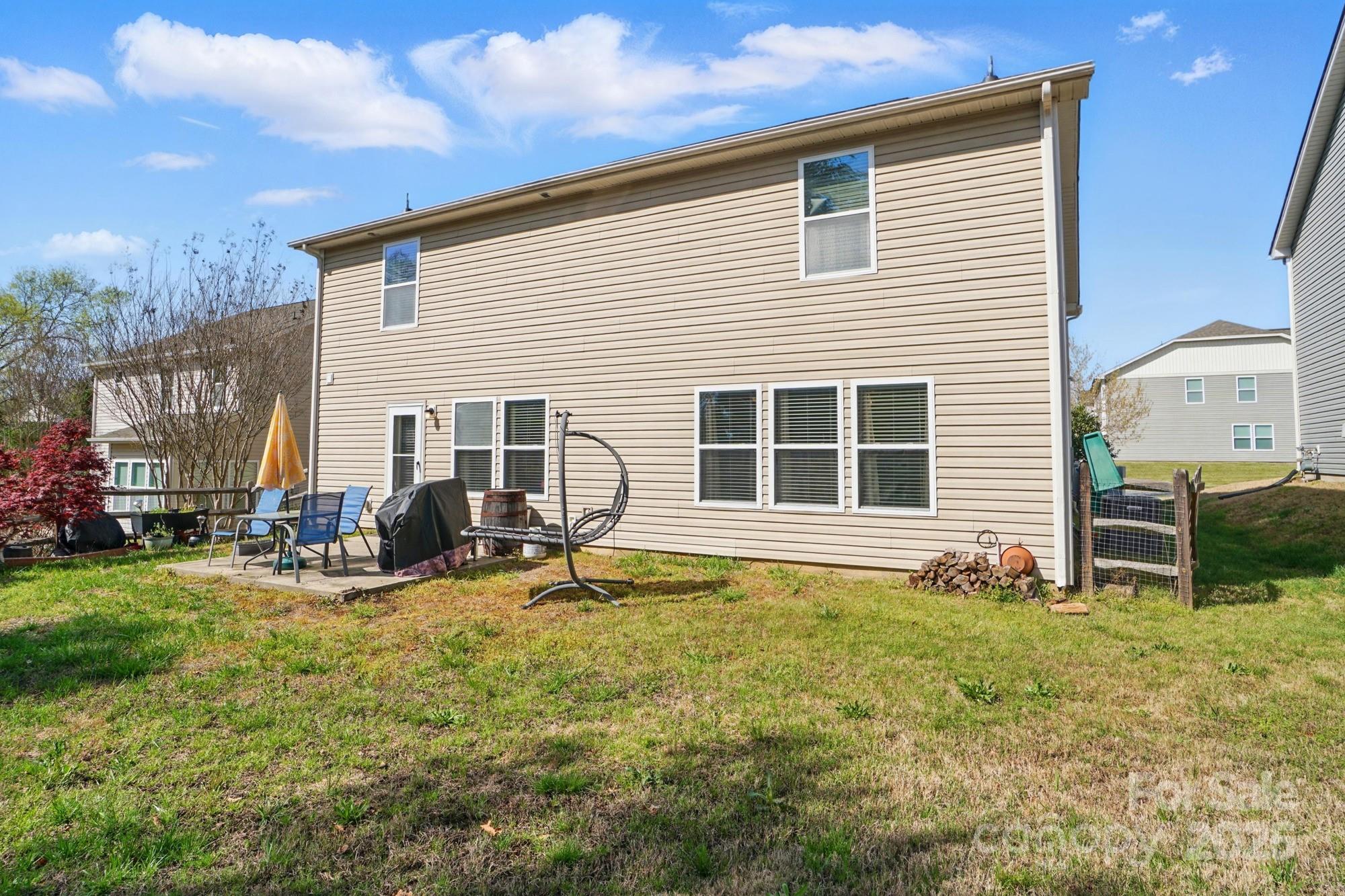 3272 Saddlebrook Drive Midland, NC 28107 - Photo 42 of 44 a view of a house with backyard sitting area and garden
