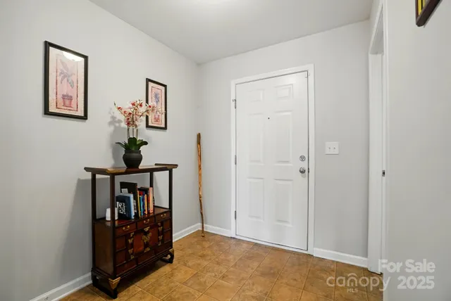 a view of an entryway with wooden floor