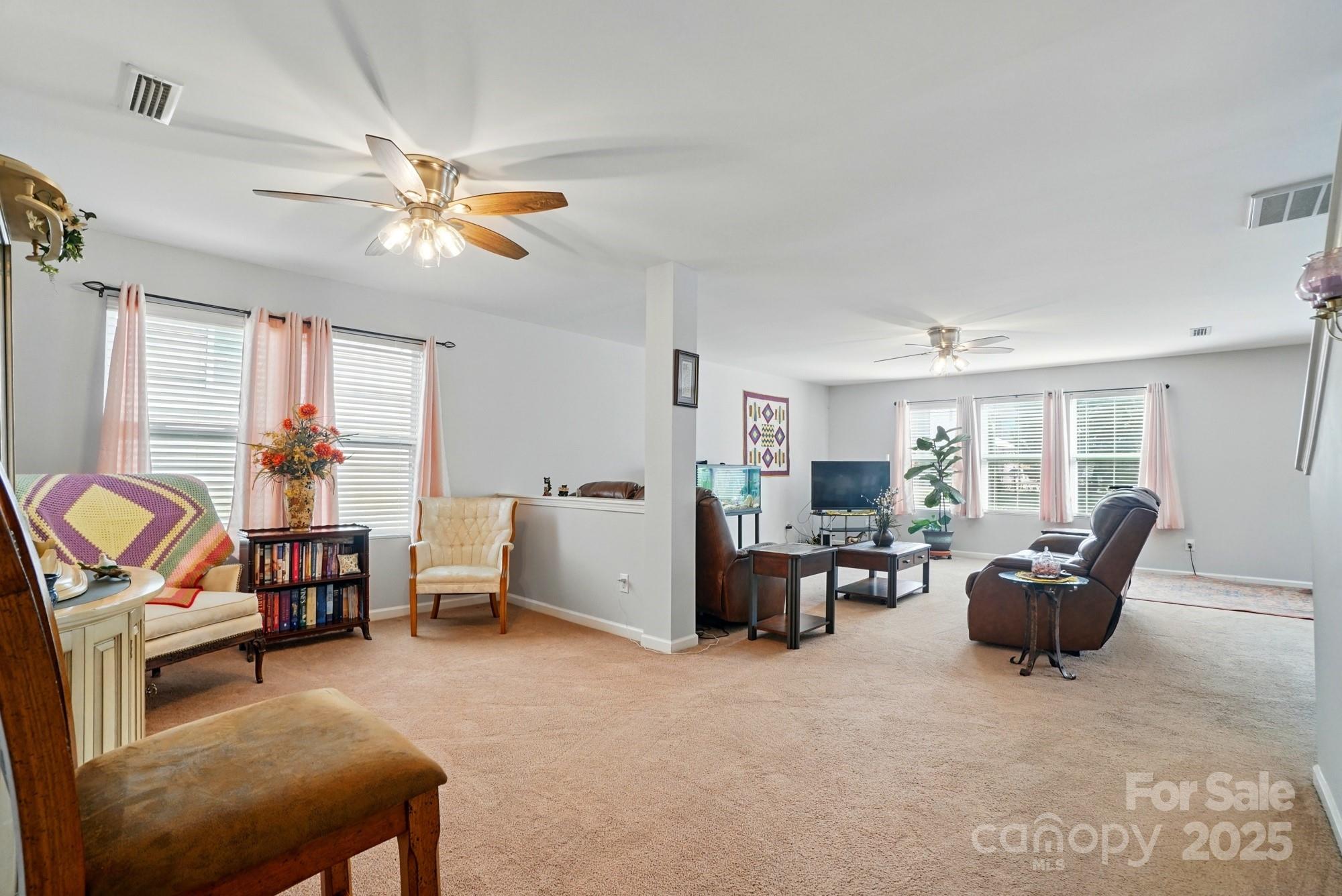 3272 Saddlebrook Drive Midland, NC 28107 - Photo 7 of 44 a living room with furniture and a flat screen tv