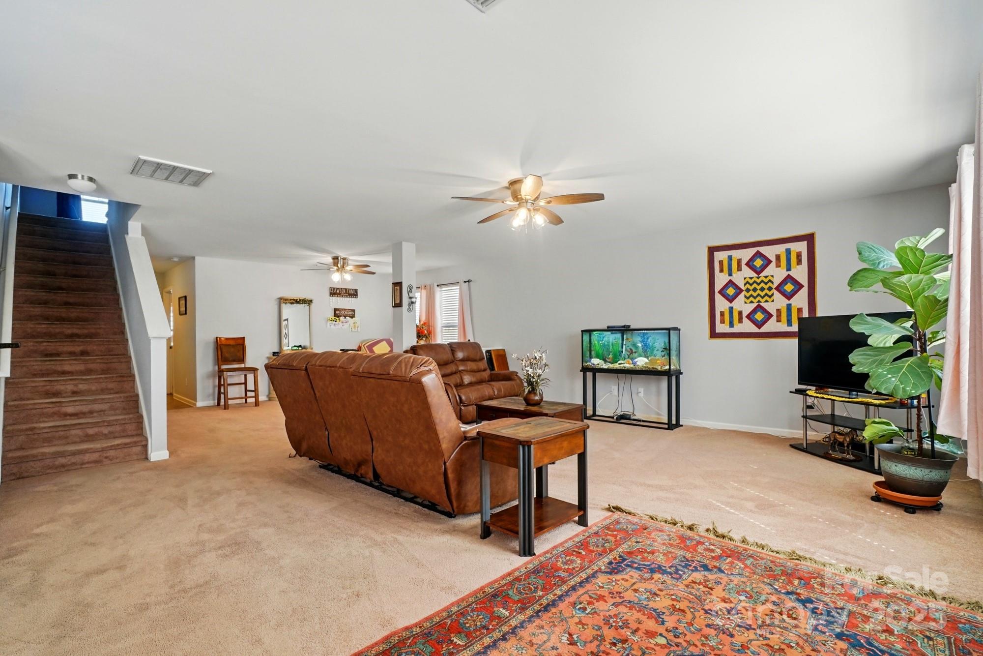 3272 Saddlebrook Drive Midland, NC 28107 - Photo 10 of 44 a living room with furniture and a potted plant