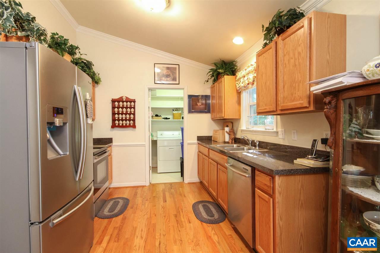 30 Begum Road Palmyra, VA 22963 - Photo 8 of 15 a kitchen with stainless steel appliances granite countertop a refrigerator a stove and a sink with wooden floor