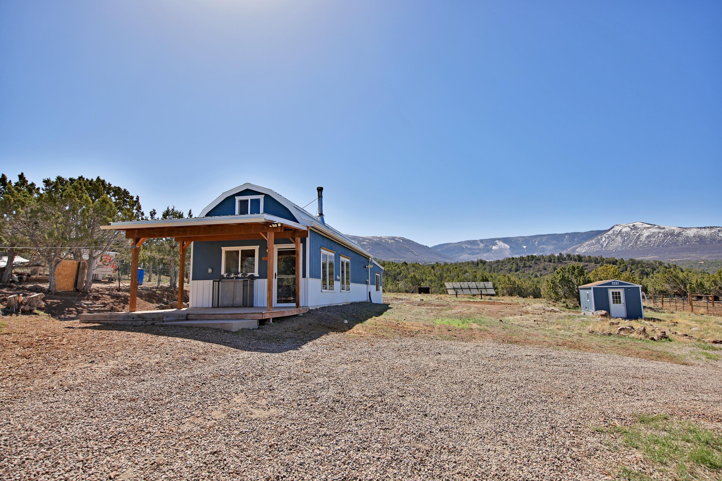 56001 KK Road Molina, CO 81646 - Photo 7 of 42 a front view of a house with a yard