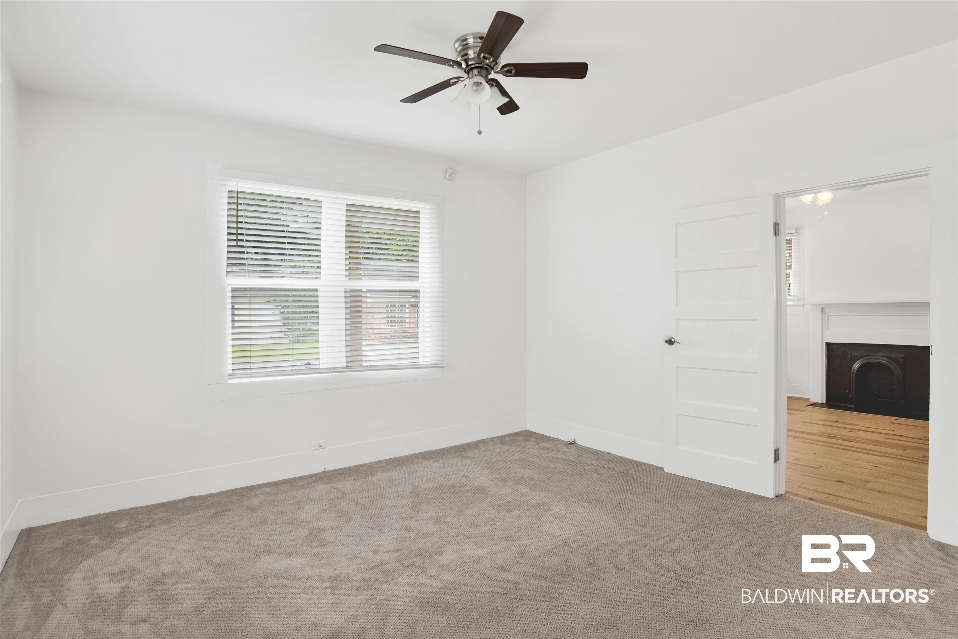 507 Holcombe Avenue Mobile, AL 36606 - Photo 25 of 28 Unfurnished bedroom with multiple windows, carpet floors, and baseboards