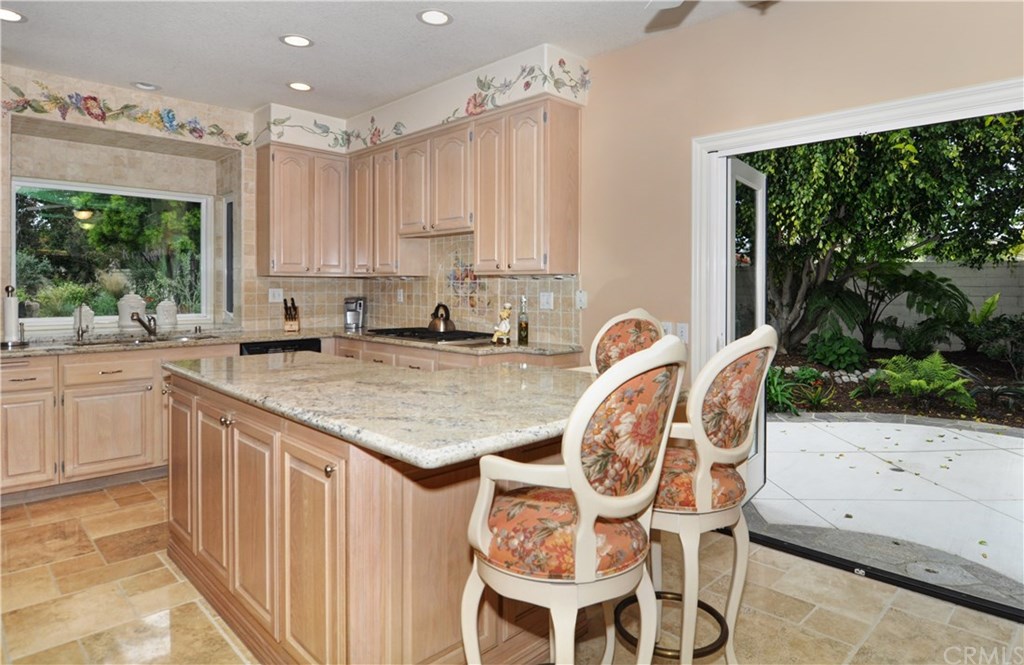 16 Via Adelia San Clemente, CA 92672 - Photo 29 of 42 a kitchen with granite countertop a sink a counter top space and stainless steel appliances