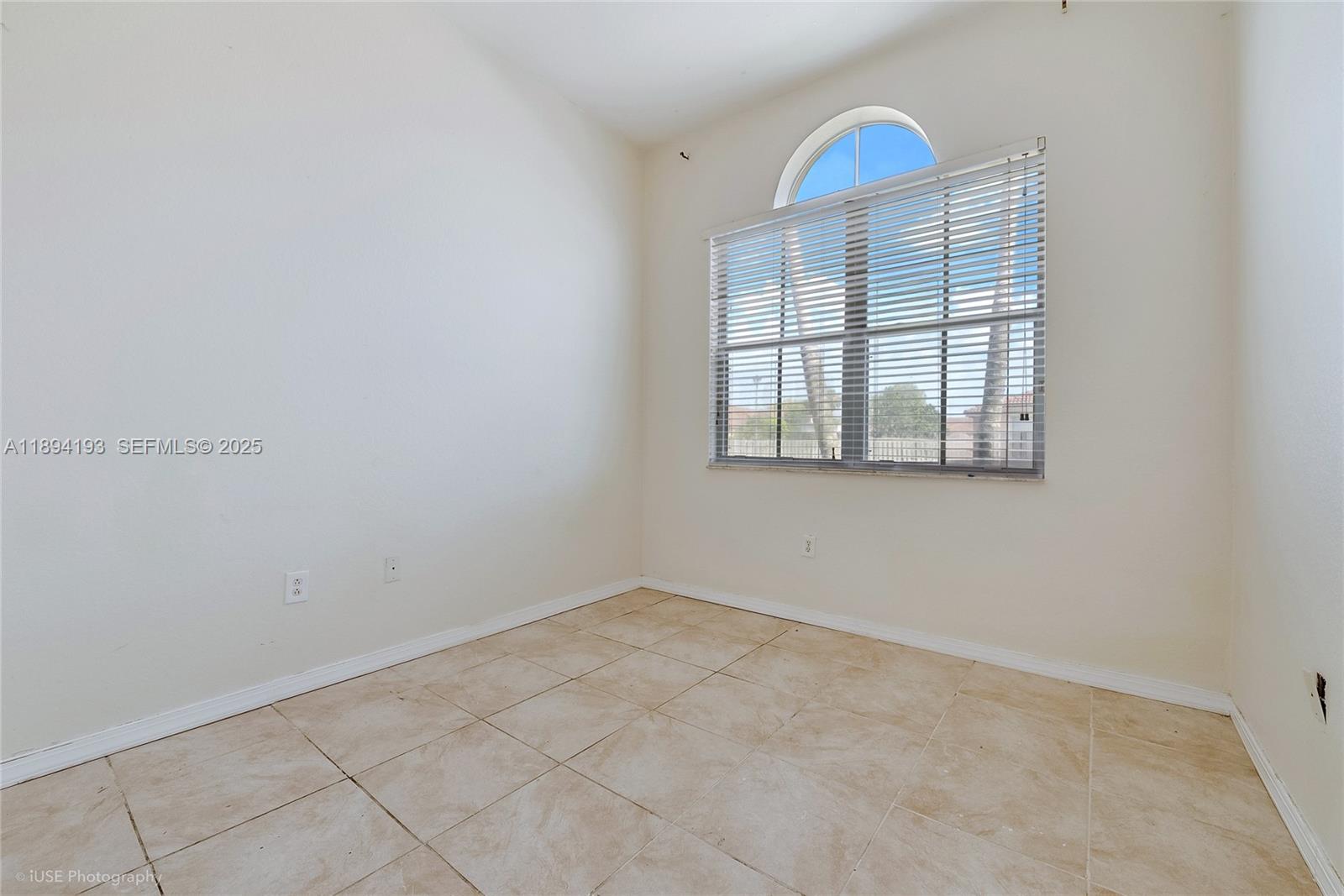 11084 Southwest 237th Lane Homestead, FL 33032 - Photo 5 of 12 an empty room with windows