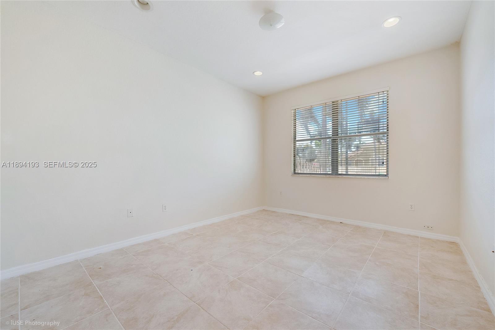 11084 Southwest 237th Lane Homestead, FL 33032 - Photo 7 of 12 an empty room with windows