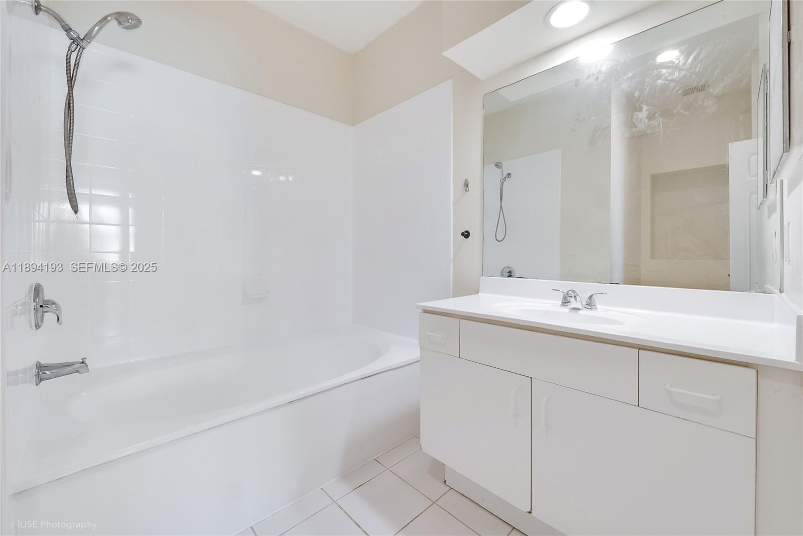 11084 Southwest 237th Lane Homestead, FL 33032 - Photo 10 of 12 a bathroom with a sink and a mirror