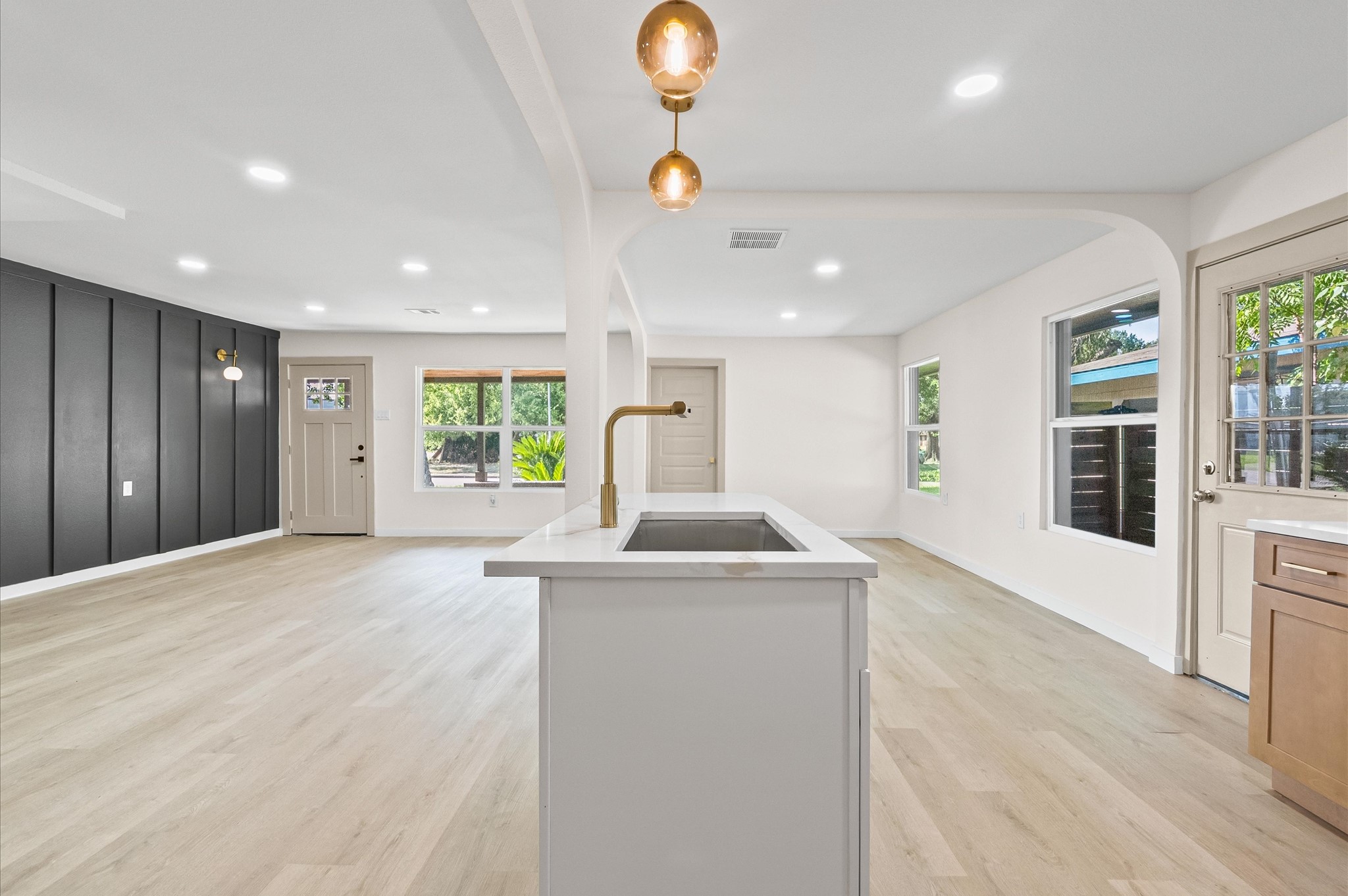 6527 Beekman Road Houston, TX 77021 - Photo 12 of 22 a kitchen with stainless steel appliances granite countertop a sink and a large window