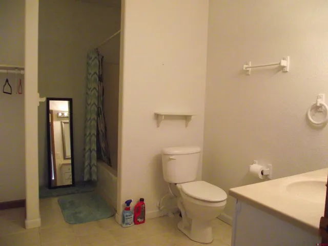 a view of a room that has a table and chairs in it