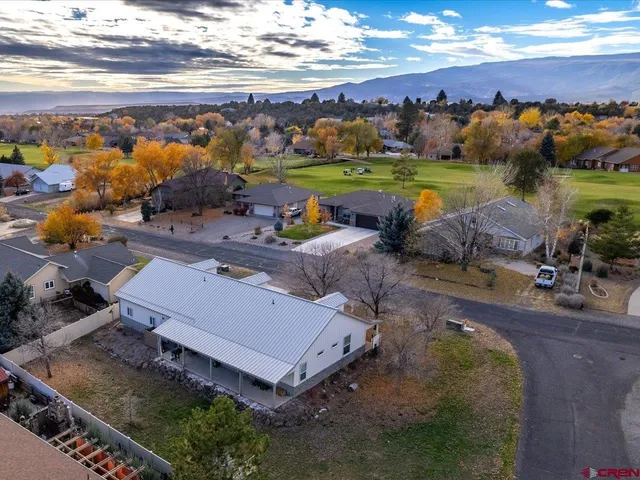 an aerial view of a house with a garden
